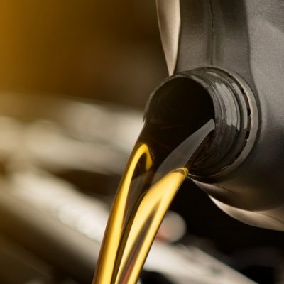 pouring-oil-lubricant-motor-car-from-black-bottle-isolated-white-background_53089-43
